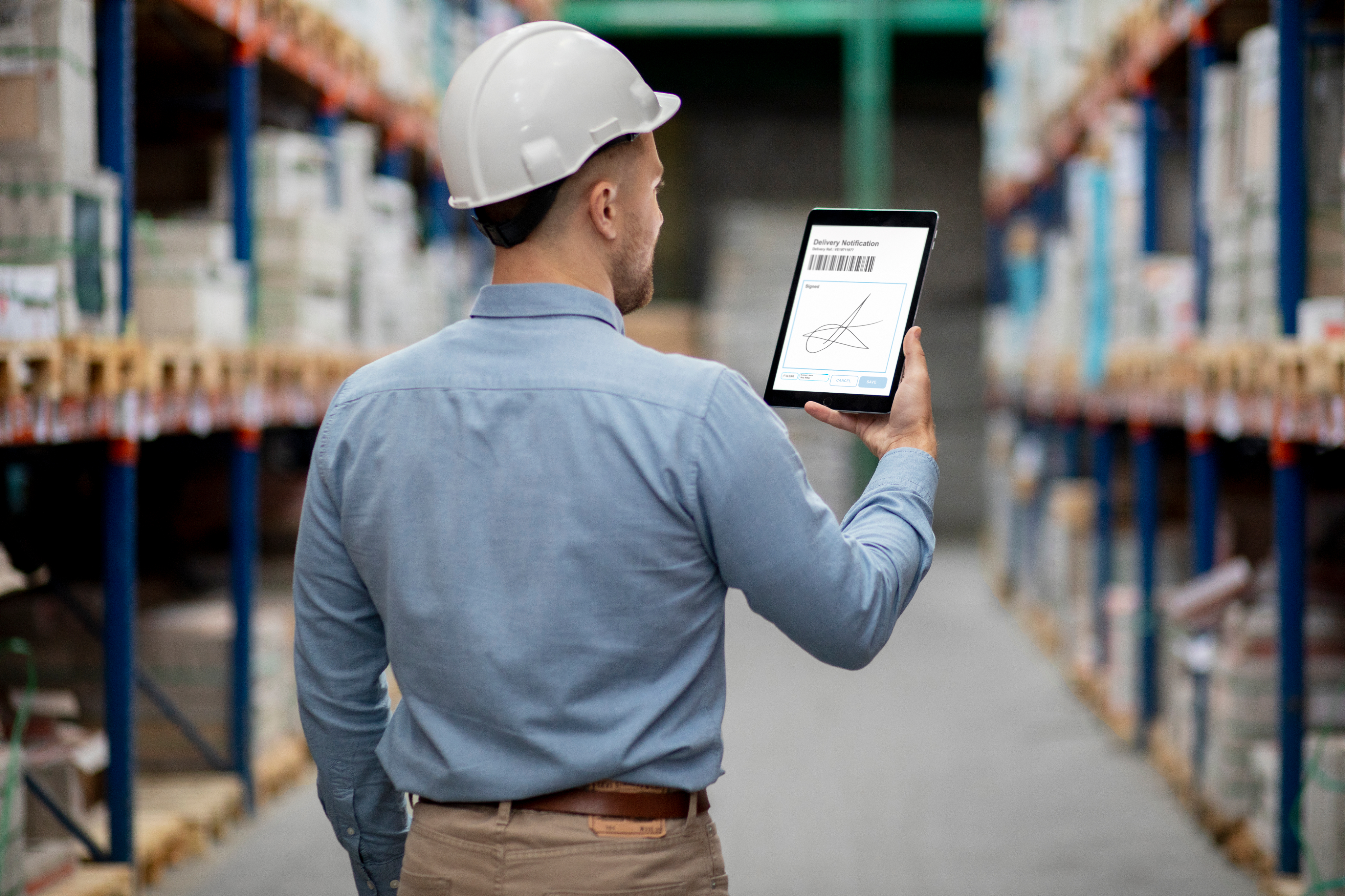 Man using a tablet in a warehouse