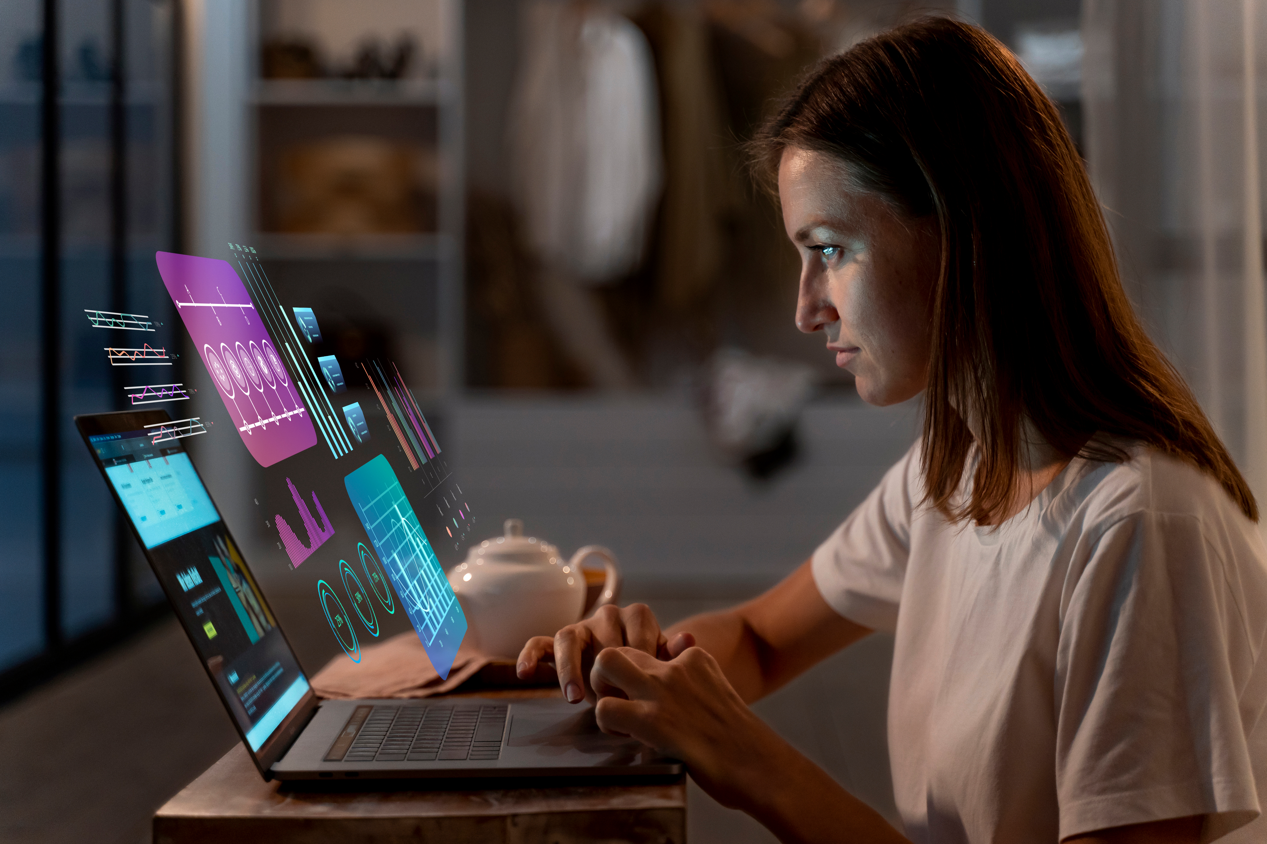 Woman working on a computer with data visualizations